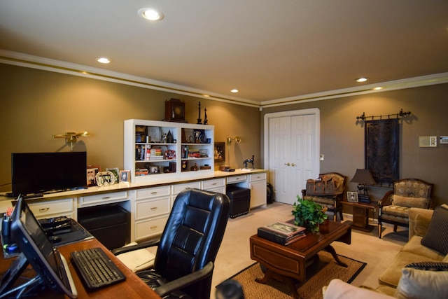 office area featuring light carpet, built in desk, and ornamental molding