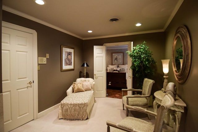 living area featuring crown molding and light colored carpet