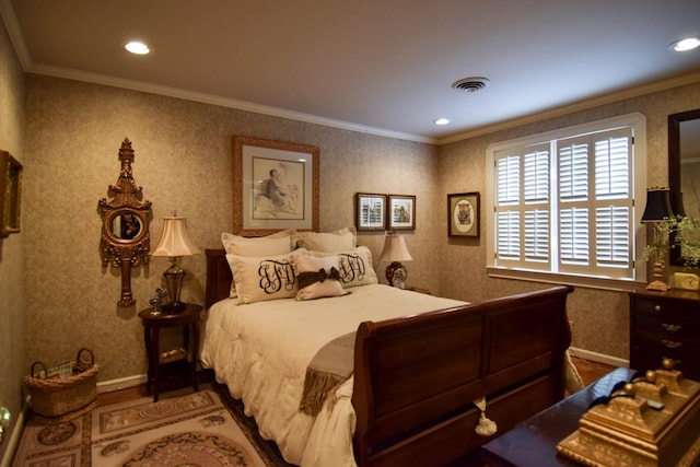 bedroom with crown molding and hardwood / wood-style flooring