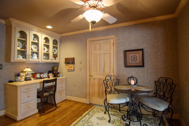 dining room featuring crown molding, ceiling fan, and light hardwood / wood-style floors