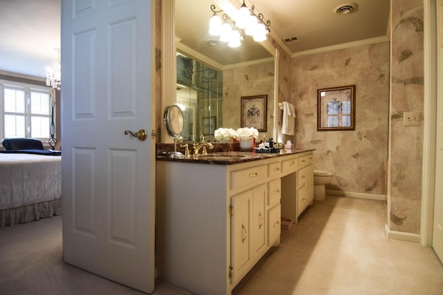 bathroom featuring vanity, crown molding, toilet, and a chandelier