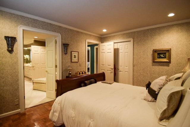 bedroom with crown molding, dark parquet flooring, ensuite bath, and a closet