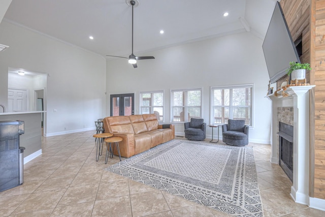 living room with light tile patterned flooring, ceiling fan, and high vaulted ceiling