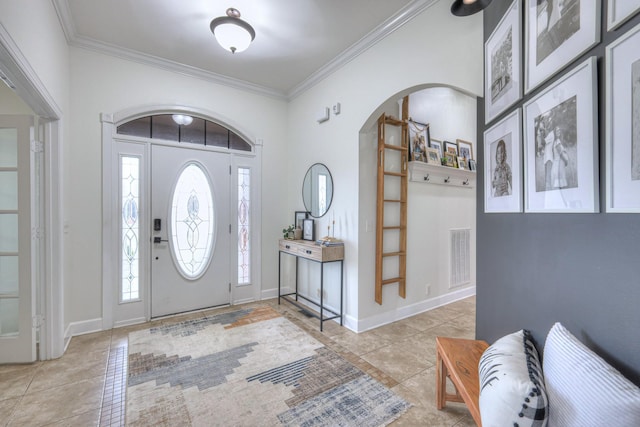 tiled foyer with ornamental molding