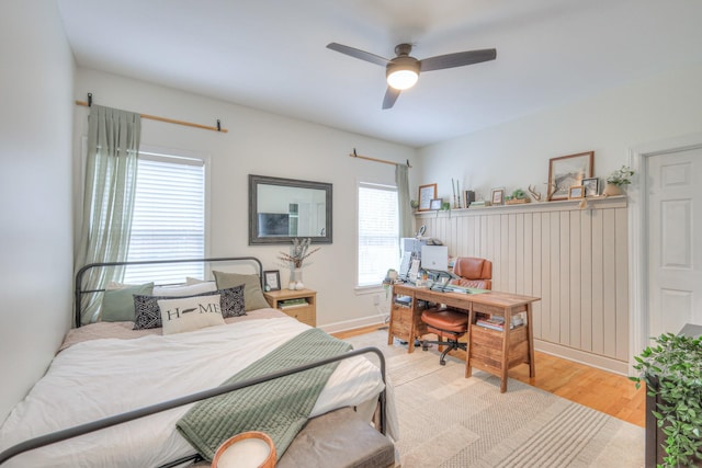 bedroom featuring ceiling fan and light hardwood / wood-style flooring