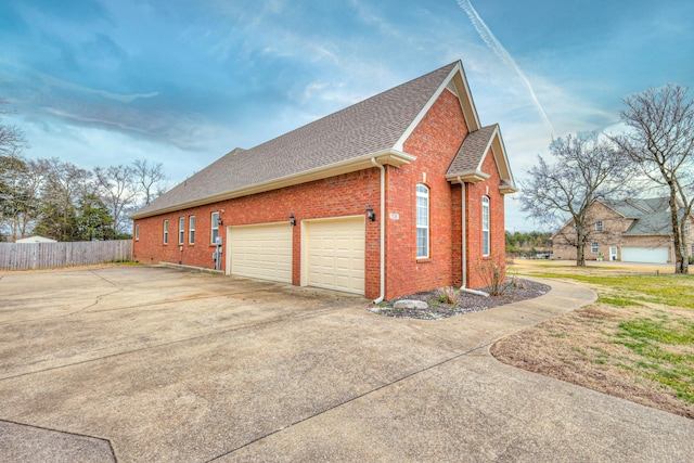 view of side of home with a garage