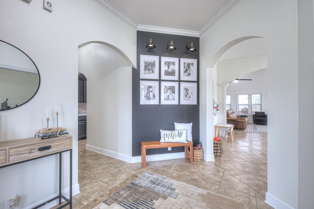 corridor with light tile patterned floors and crown molding