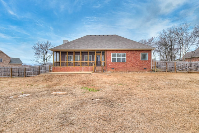 back of property featuring a sunroom and a patio area