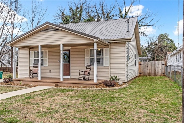 view of front of home with a porch and a front lawn