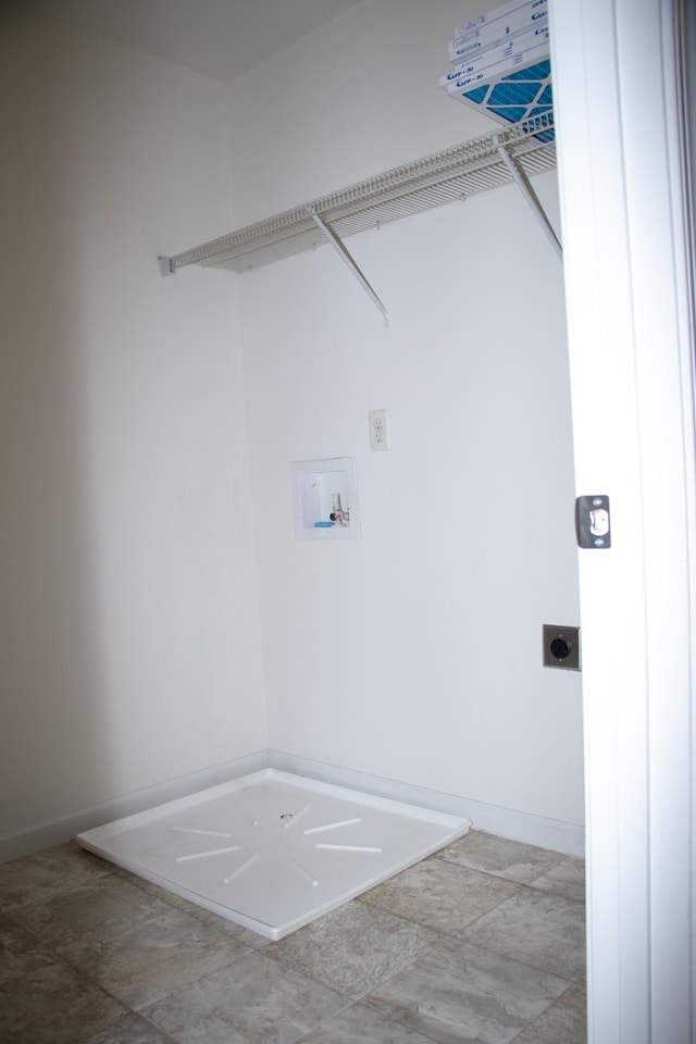 clothes washing area with hookup for an electric dryer and hookup for a washing machine