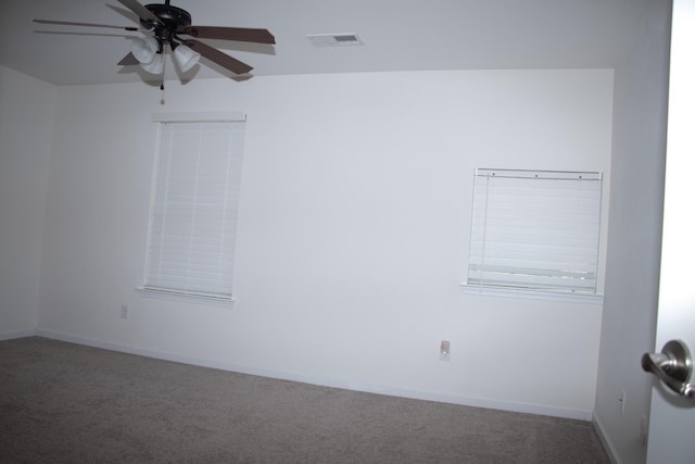 carpeted empty room featuring ceiling fan