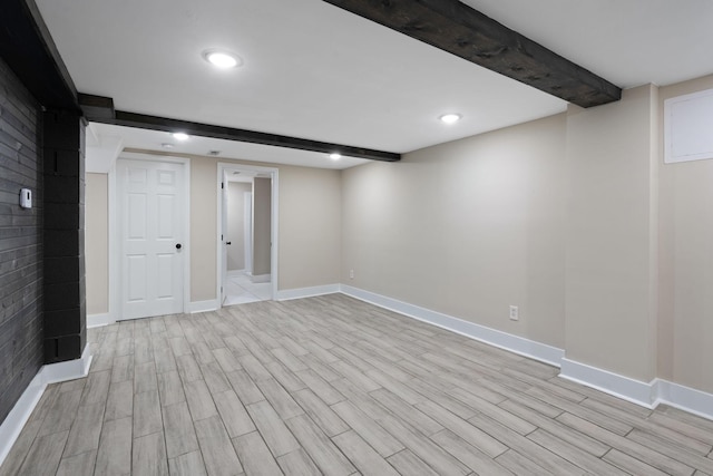 finished below grade area featuring wood tiled floor and baseboards