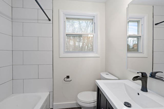 full bathroom featuring toilet, plenty of natural light, shower / bathing tub combination, and vanity