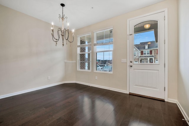 interior space featuring dark hardwood / wood-style floors and a notable chandelier