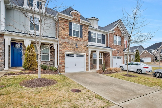 townhome / multi-family property featuring a garage and a front lawn