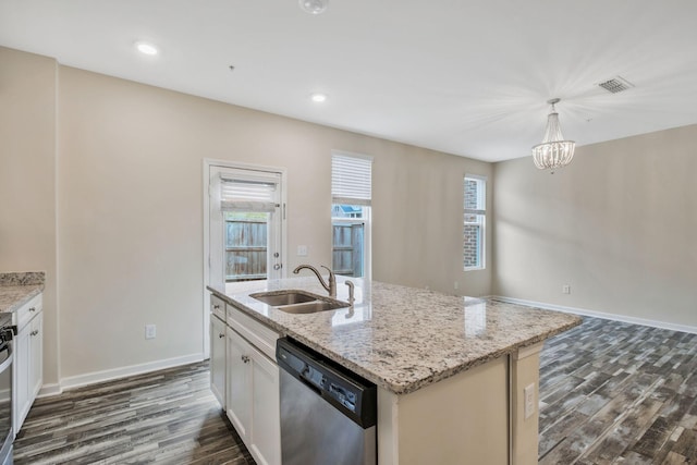 kitchen with sink, hanging light fixtures, a center island with sink, stainless steel dishwasher, and light stone countertops