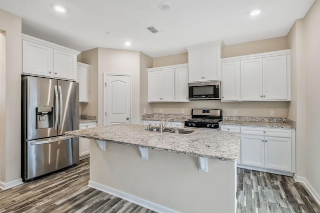 kitchen with white cabinetry, sink, a center island with sink, and appliances with stainless steel finishes