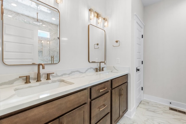 bathroom with vanity and a shower with shower door