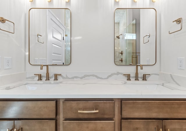 bathroom with vanity and a shower