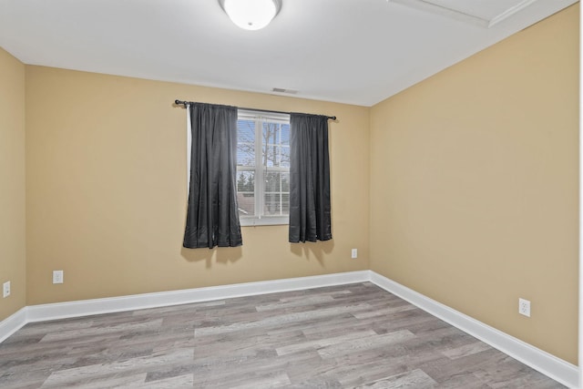 unfurnished room featuring light wood-type flooring