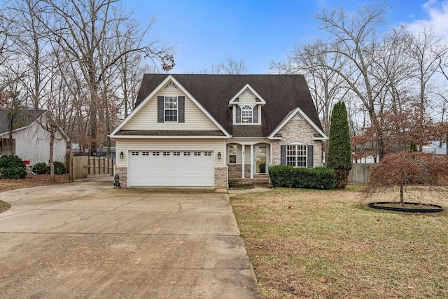 view of front of house with a garage and a front yard