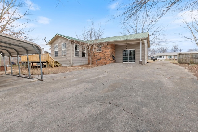 exterior space featuring a carport