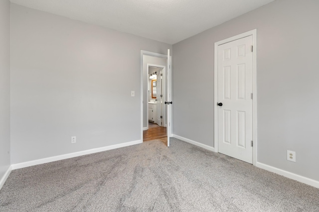 unfurnished bedroom with carpet floors