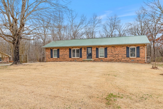 ranch-style house with central AC and a front lawn