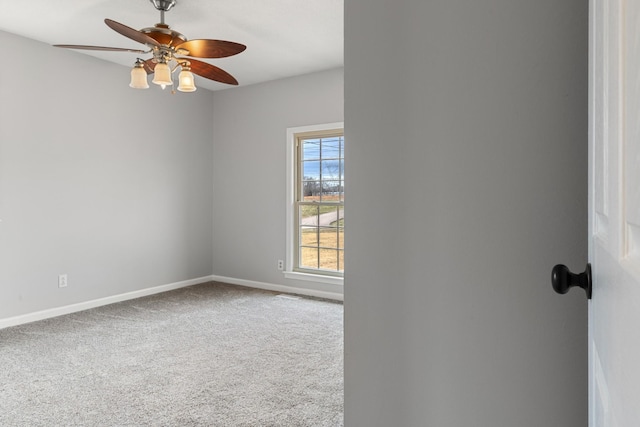 empty room featuring ceiling fan and carpet flooring