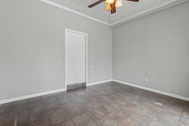 spare room featuring crown molding and ceiling fan