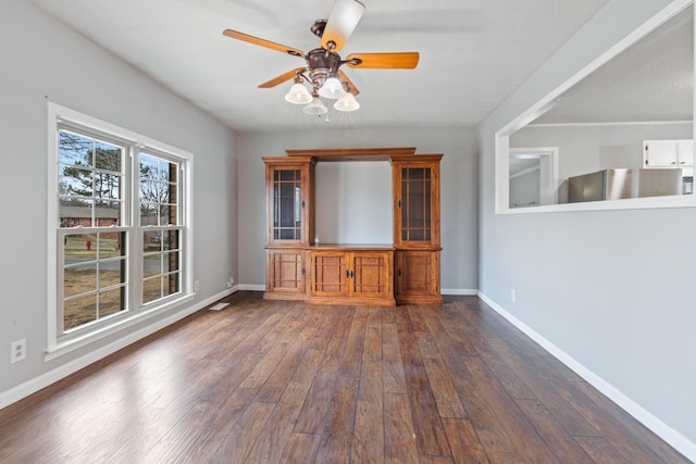 interior space featuring dark hardwood / wood-style floors and ceiling fan