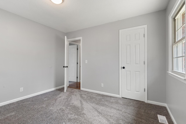 unfurnished bedroom featuring carpet flooring