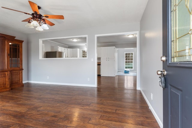 interior space featuring ceiling fan and dark hardwood / wood-style floors