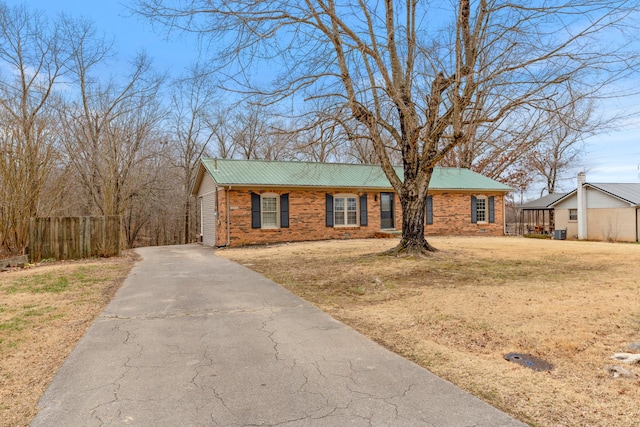 ranch-style house with a front lawn