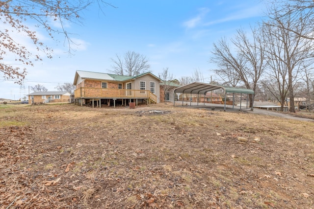 back of house featuring a carport and a deck