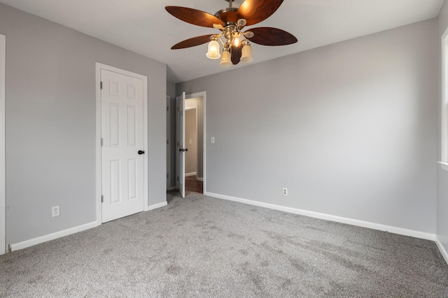 carpeted empty room with ceiling fan