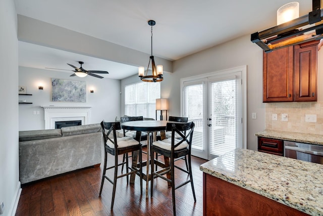 dining room with dark wood-type flooring and french doors