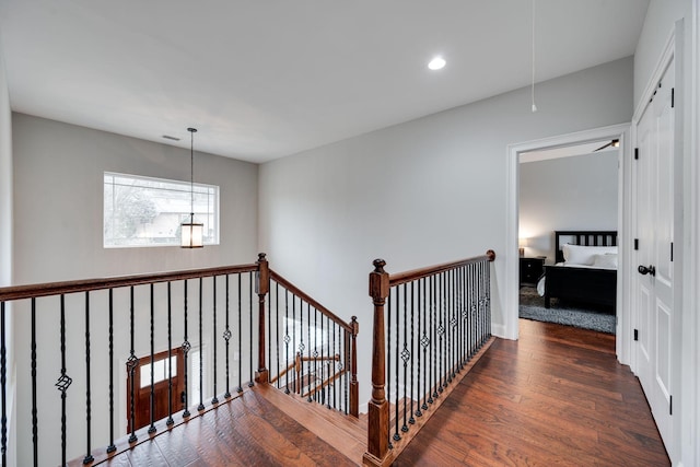 hallway with dark wood-type flooring