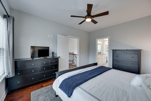 bedroom featuring connected bathroom, dark hardwood / wood-style floors, and ceiling fan