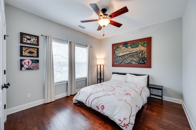 bedroom featuring ceiling fan and dark hardwood / wood-style floors