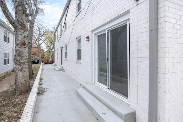 view of side of home featuring a patio area