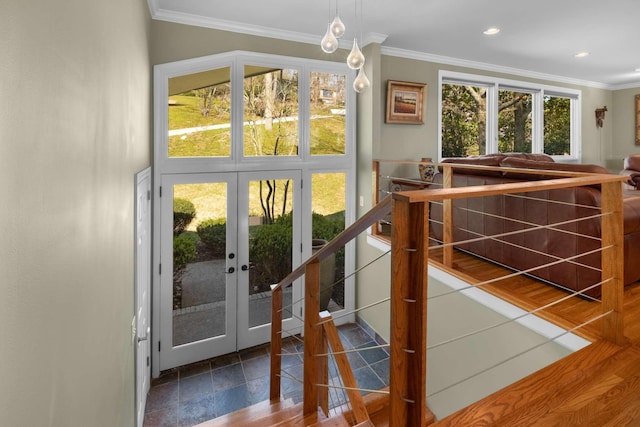 doorway to outside with crown molding and french doors