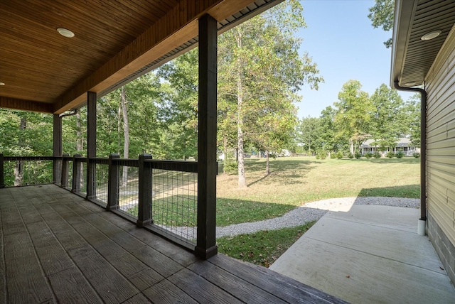 wooden terrace with a yard