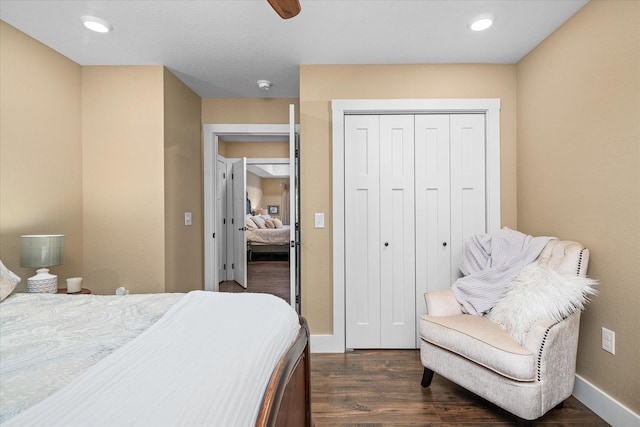 bedroom with a closet and dark hardwood / wood-style floors