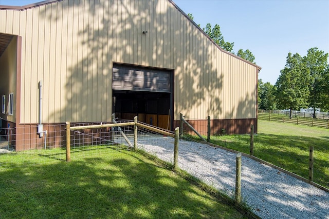 view of outdoor structure with a lawn