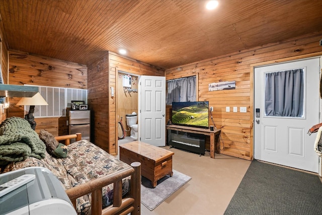 living room featuring wooden walls and wooden ceiling