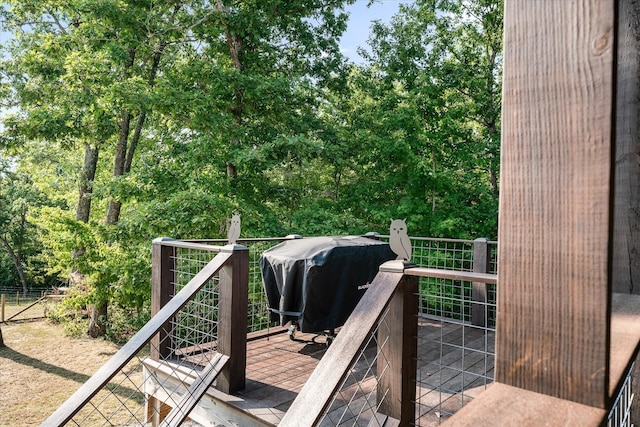 wooden terrace with area for grilling