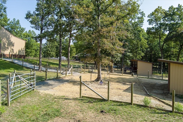 view of home's community with an outdoor structure and a rural view