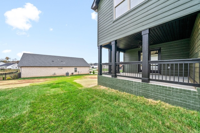 view of yard featuring covered porch