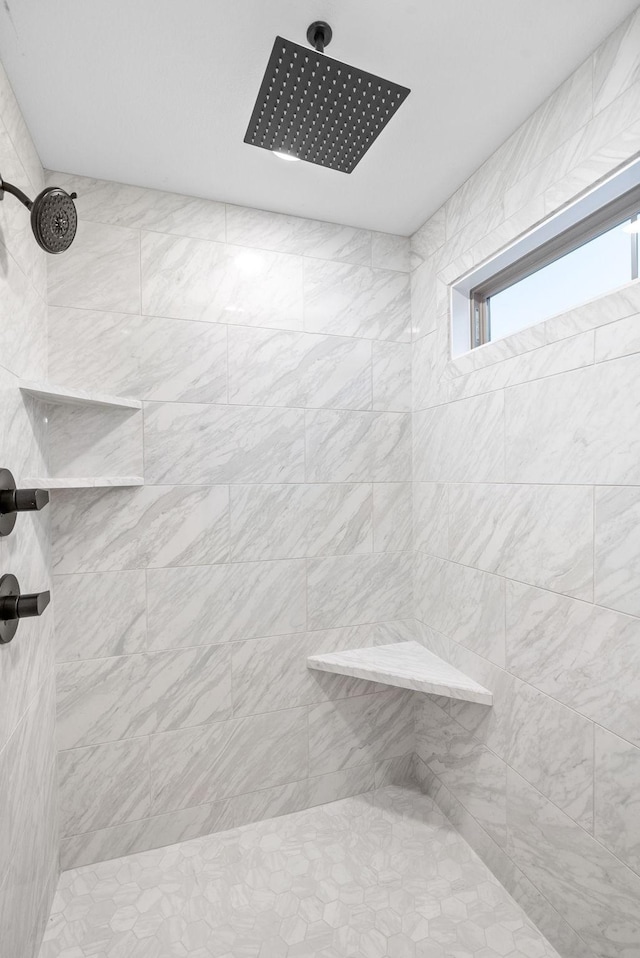 interior space with tiled shower